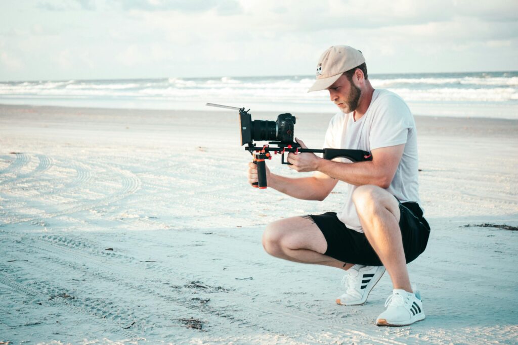 Man holding black dslr camera outdoors