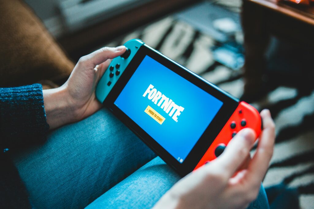 A person holding a game console