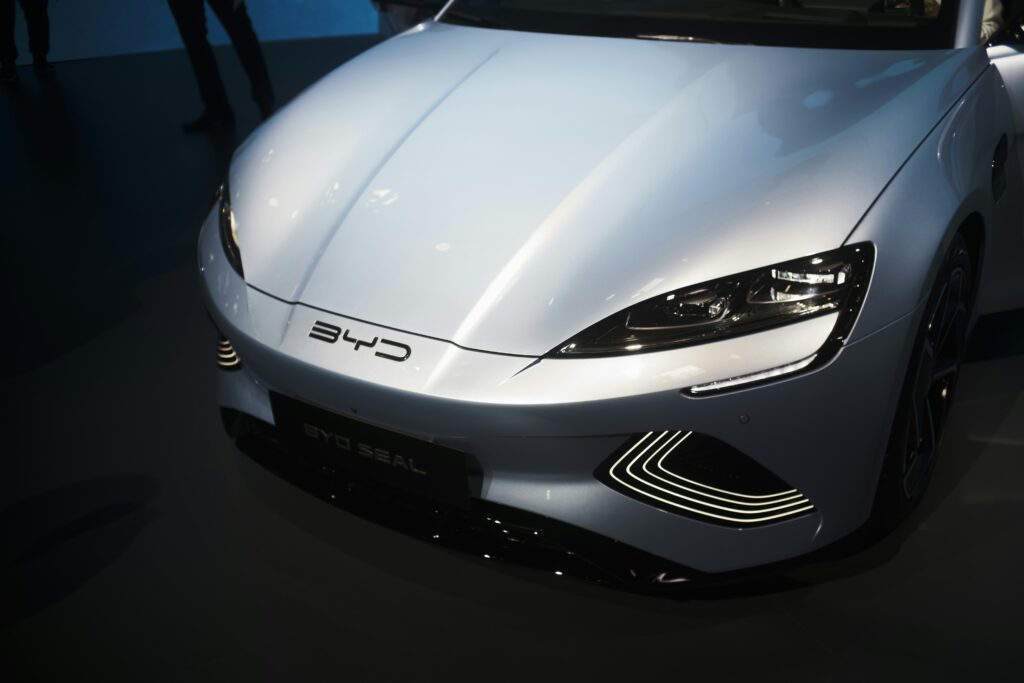 a white sports car is on display at a car show stockpack unsplash
